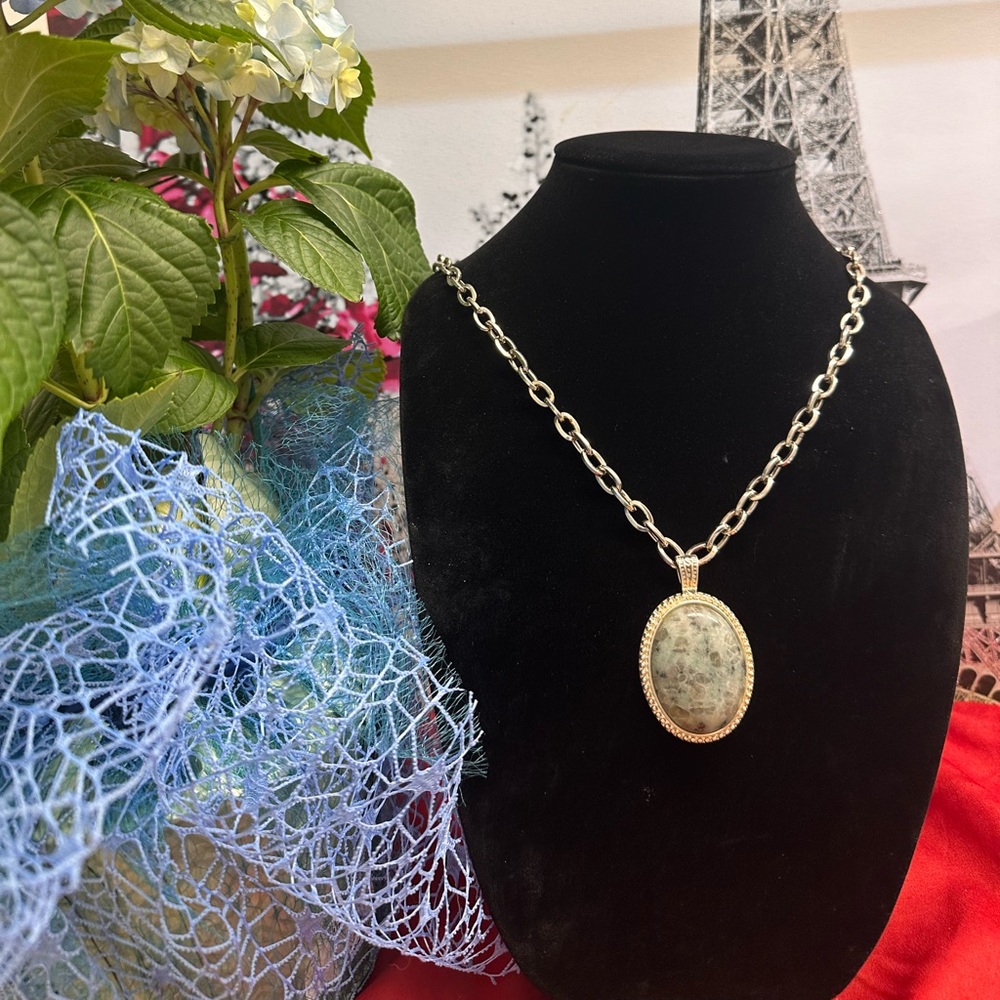 silver tone necklace with green amethyst stone medallion